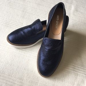 Metallic blue snake skin slip ons